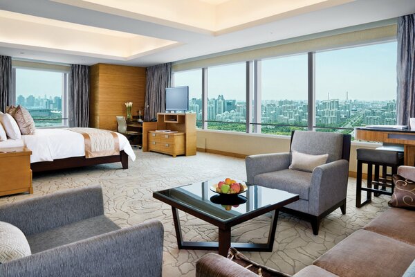 Interior of a living room in an apartment with panoramic windows 