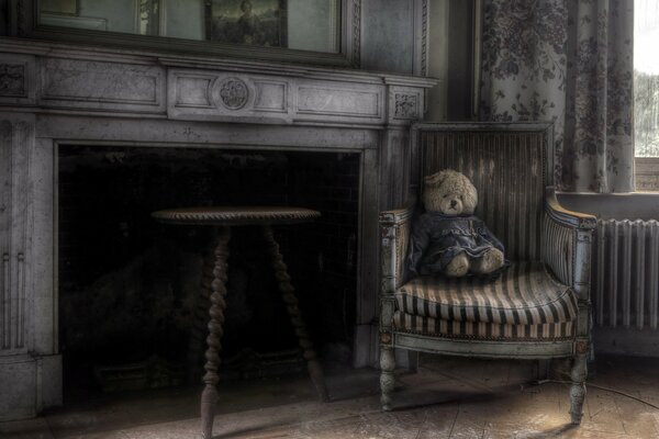 Teddy bear in the armchair fireplace room
