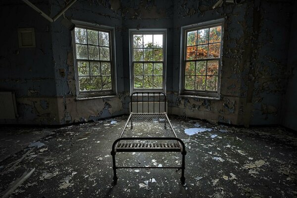 An iron bed in an abandoned house