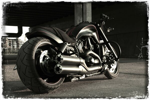 Motorcycle framed in a gray background under retro