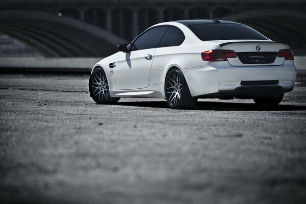 White BMW and its rear view