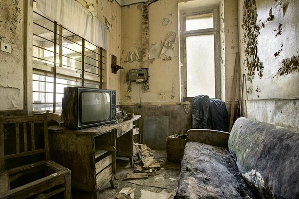 Soviet abandoned apartment with a clean TV