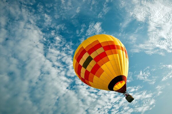 Orange-yellow balloon in the sky