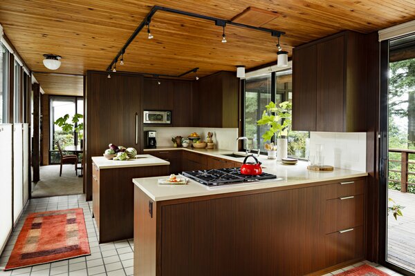 Brown kitchen with wooden ceiling