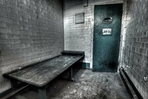 Prison cell with a bunk picture