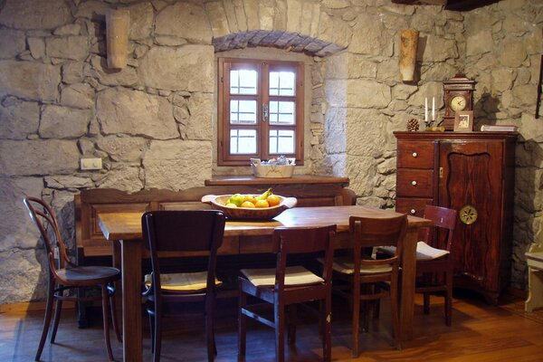 Stone walls and wooden furniture in a Mediterranean interior