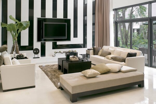Stylish sofa and TV in the room