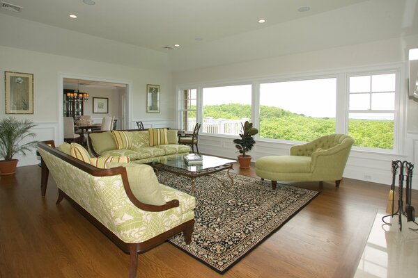 The interior of a chic living room in green tones