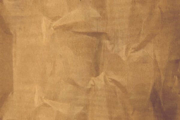 Помятый старинный лист раскрывает свою текстуру