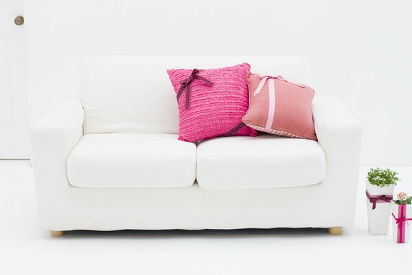 A white sofa in a white room