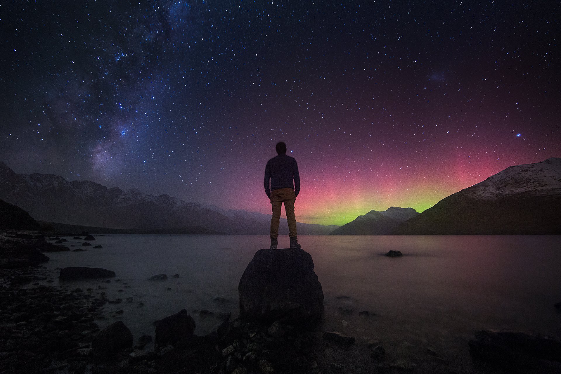 milky way new zealand man reflections stones mountain landscape star