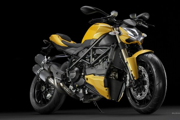 Black ducatti motorcycle with yellow elements