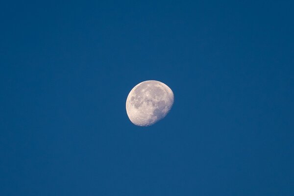 The moon in the blue infinity of space