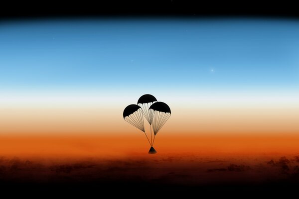 Three parachutes took off into the sky at sunset