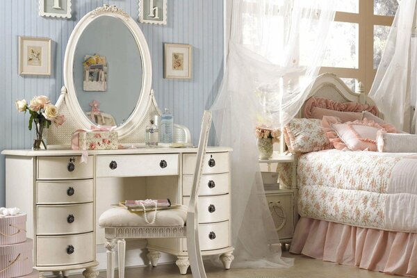 Pink pillows with frills. Round mirror