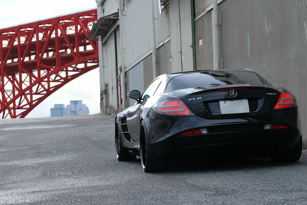 Black Mercedes Benz in front of the bridge