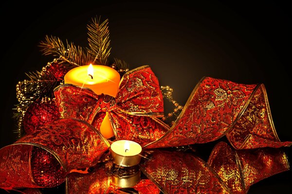 Christmas decorations on the background of ribbons and candles