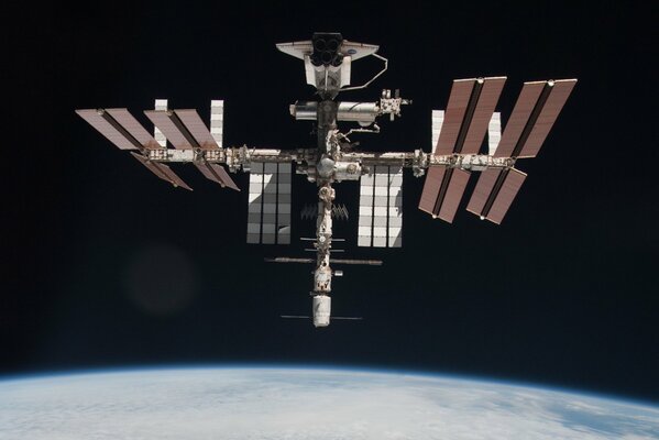 Docking of the space station with the ship