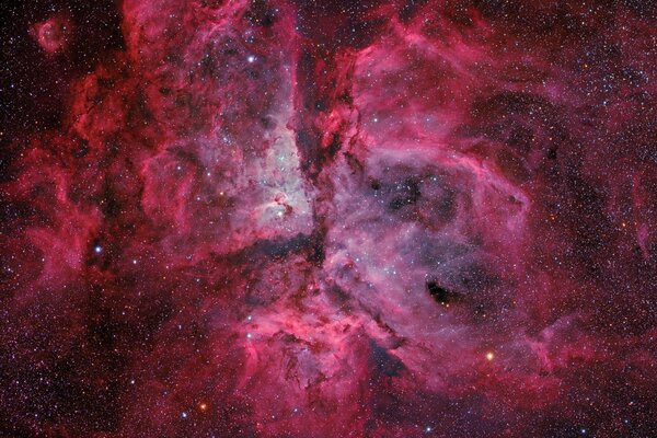 Pink hazy glow on the background of dark space