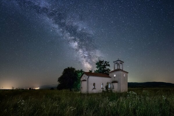 Milky Way on the background of the Church of Peter and Paul in Bulgaria