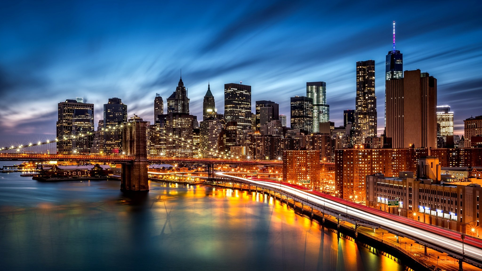 new york brooklyn bridge east river manhattan brooklyn usa city night evening river shadows lights skyscrapers buildings road illumination