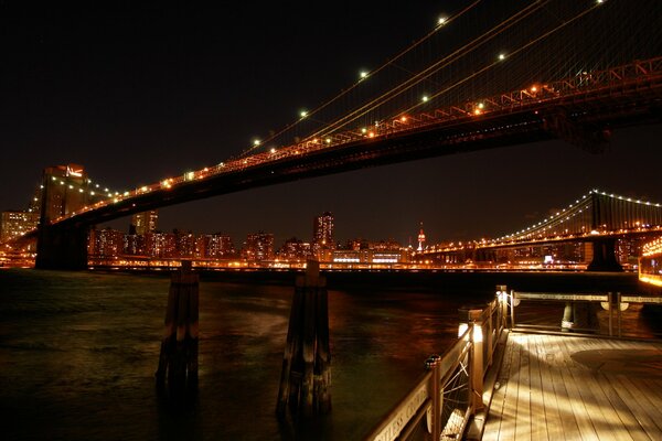 Bridges hung with lanterns in New York City at night