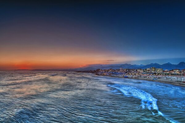 Sea surf in the evening sunset