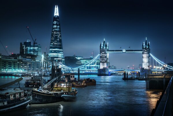 London boats at the pier with a tower