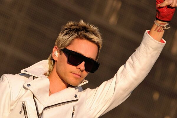 Jared Leto in glasses and a white jacket