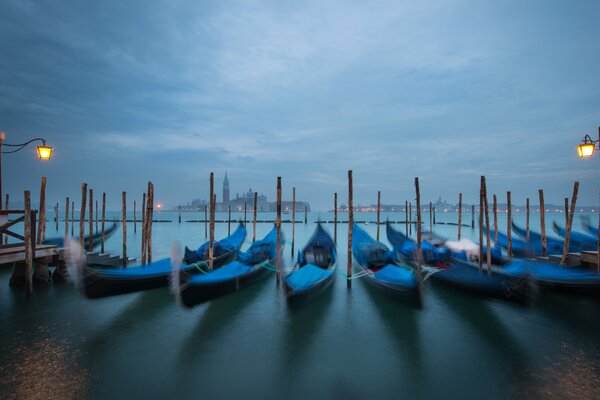 Venetian gondolas in the light of lanterns