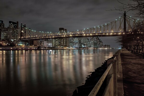 Bridge in New York at night in the lights of buildings