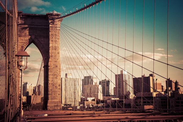 Brooklyn Bridge in New York against the backdrop of many buildings