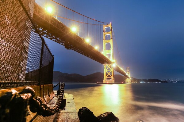 Bridge across the strait on the background of the night sky