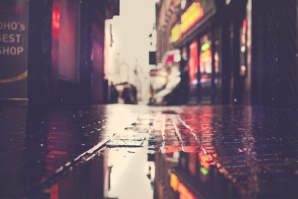 Wet asphalt with puddles in London