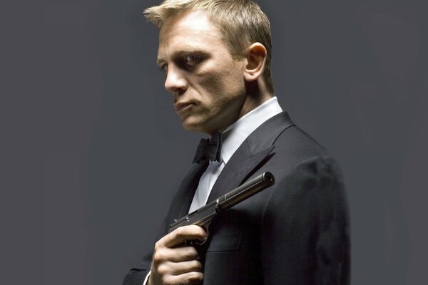 James Bond in a suit with a gun