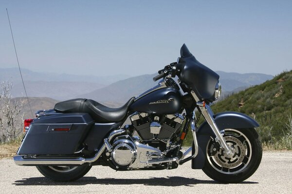 The black motorcycle impresses with its beauty and rigor