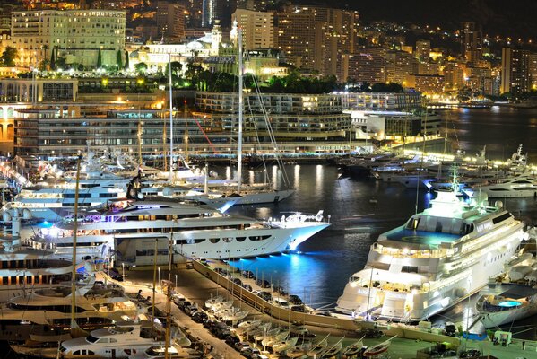 Yachts in Monaco on the background of evening lights