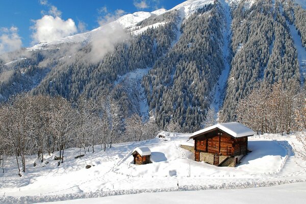 Mountain house in winter in the mountains