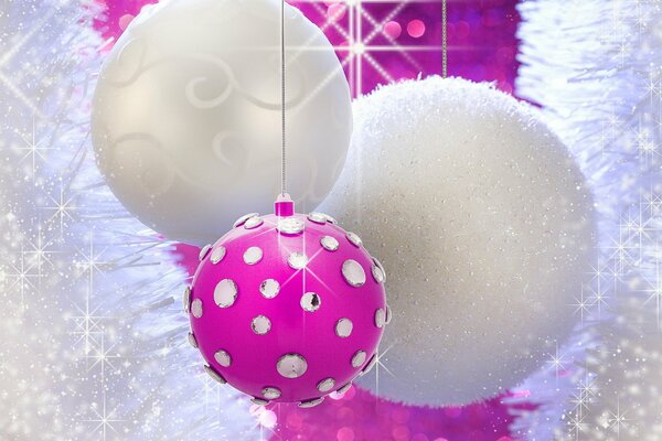 Christmas background two white and one pink ball