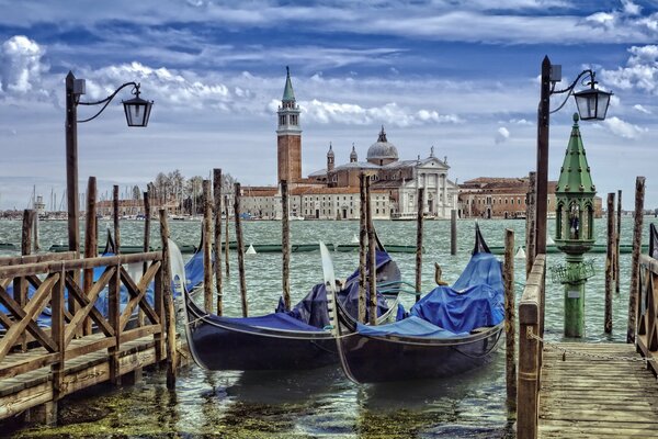 Two gondolas moored in Venice