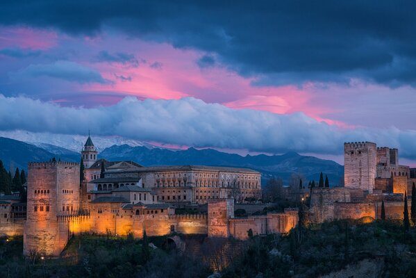 The Alhambra is in the arms of the night. Evening in the Alhambra. Sky in the evening in Granada, Spain