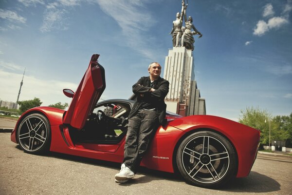 Nikolay Fomenko with a red car