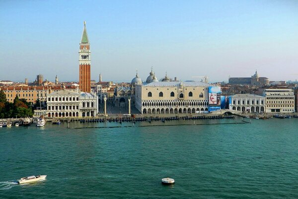 In Italy, there are many berths with boats in the city of Venice