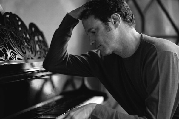 Colin Firth plays the piano