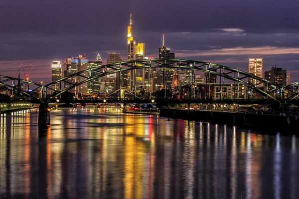 Bridge over the river on the background of Frankfurt