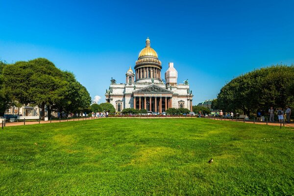 . Temple on the background of the sky and green grass and trees