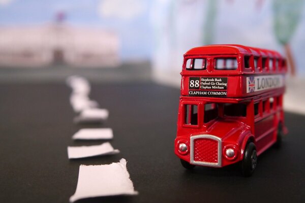 Toy bus on the background of the road