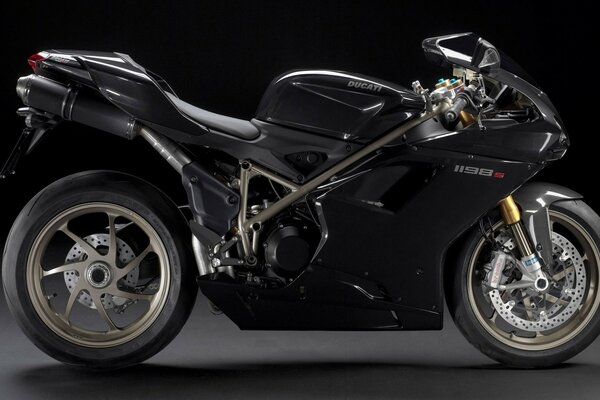The super bike is black. Ducati 1198 motorcycle on a black background