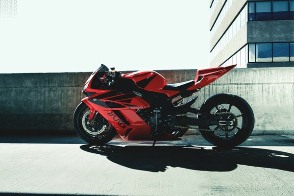 Red honda motorcycle with black stripes