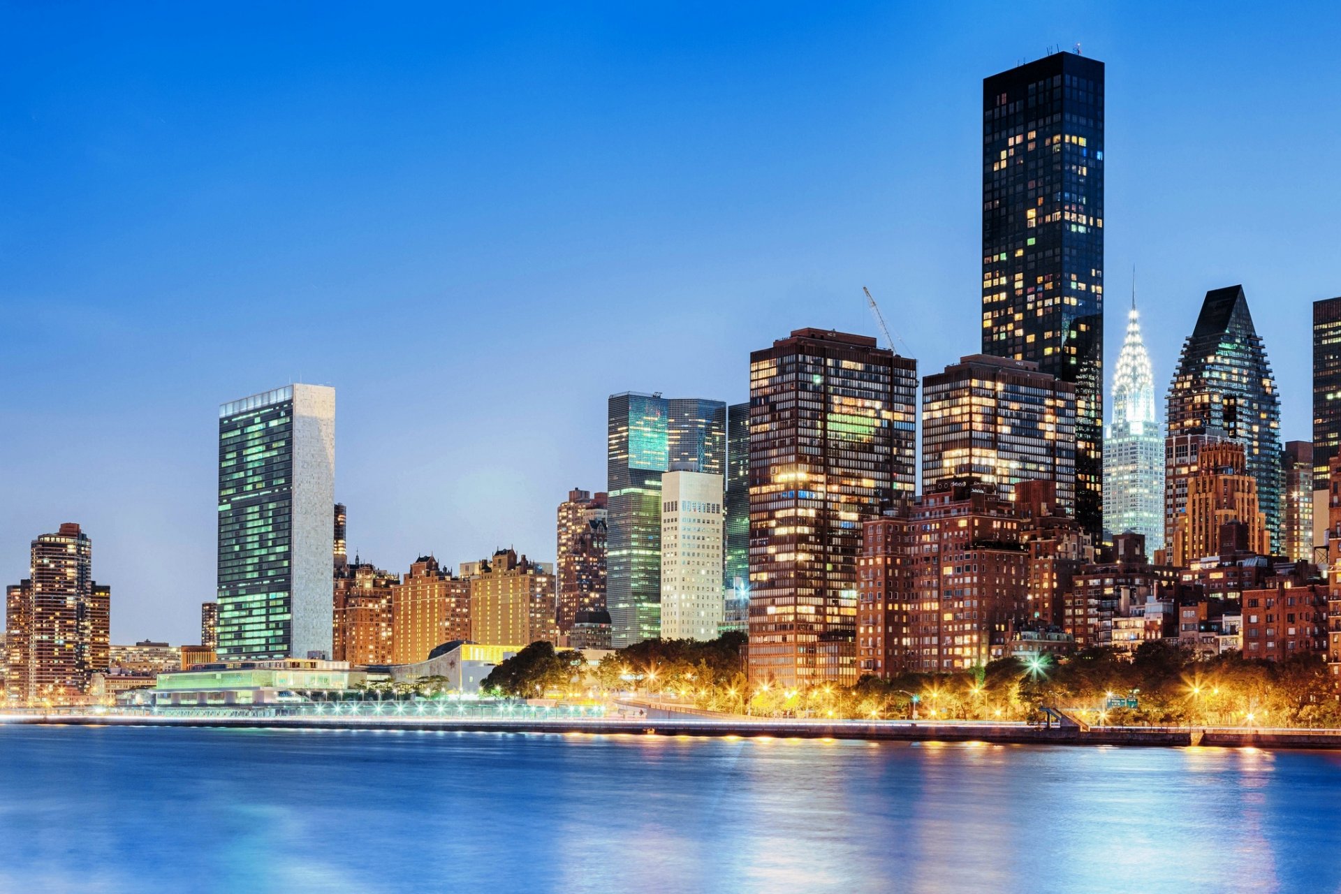 new york manhattan usa east river chrysler building river evening city lights buildings houses skyscrapers high-rise